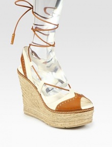 Chunky hemp wedge and platform surrounded by perforated leather straps and a leather tie that makes its way up the ankle. Hemp wedge, 5 (125mm)Hemp platform, 1½ (40mm)Compares to a 3½ heel (90mm)Leather upperLeather liningRubber solePadded insoleMade in SpainOUR FIT MODEL RECOMMENDS ordering true size. Chunky hemp wedge and platform surrounded by perforated leather straps and a leather tie that makes its way up the ankle. Hemp wedge, 5 (125mm)Hemp platform, 1½ (40mm)Compares to a 3½ heel (90mm)Leather upperLeather liningRubber solePadded insoleMade in SpainOUR FIT MODEL RECOMMENDS ordering true size.