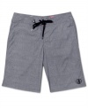 Summer starts here. Lock down your casual look with these sweet board shorts from Volcom.