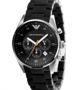 Classic style with a modern edge. This Emporio Armani watch features a black silicone-wrapped stainless steel bracelet and round case. Black chronograph dial with silvertone stick indices and numerals, logo, date window and three subdials. Analog movement. Water resistant to 50 meters. Two-year limited warranty.