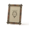 The Olivia Riegel Peridot & Topaz Enamel Frame is Harlequin inspired. In peridot and topaz Swarovski crystals and enamel.