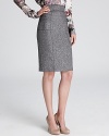 An essential addition to any working wardrobe, this tweed Bloomingdale's Exclusive BASLER pencil skirt streamlines your 9-to-5 style with feminine sophistication.