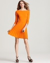 Sharp knife pleats compose the full skirt of this See By Chloé knit dress for a modern look with distinct retro appeal.