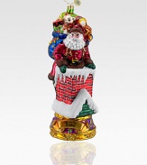 Inspired by the famous Christmas song, a fancily decorated Santa carefully makes his way down the chimney with a bag full of toys. Hand-blownHand-painted7½ highMade in Poland