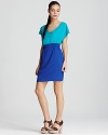 A cool palette takes on a color block design on this Aqua dress, finished with slouched short sleeves and a cinched waist.