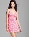 Betsey Johnson mixes sweet and sassy in a heart print slip with sheer floral lace trim.