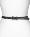 Crafted from fine leather, Lauren by Ralph Lauren's skinny leather belt is a versatile finish whether worn to cinch chunky knits or slipped through denim.