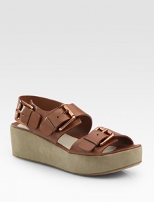 Soft leather defined by wide, rose goldtone buckles and a velvety suede platform. Suede platform, 1¾ (45mm)Leather upperLeather liningBuffed leather solePadded insoleImportedOUR FIT MODEL RECOMMENDS ordering true size. Soft leather defined by wide, rose goldtone buckles and a velvety suede platform. Suede platform, 1¾ (45mm)Leather upperLeather liningBuffed leather solePadded insoleImportedOUR FIT MODEL RECOMMENDS ordering true size.