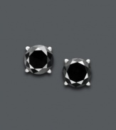 Dynamic diamond earrings that make a statement. Round-cut black diamonds (1-1/2 ct. t.w.) create a stunning silhouette against a 14k white gold post setting. Approximate diameter: 1/6 inch.