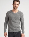 A tweed pattern and classic ribbed trim add texture to this pullover sweater.V-neckRaglan sleevesRibbed trim80% wool/20% polyamideDry cleanImported