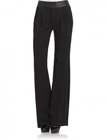 THE LOOKSatin waistband with notched backTab front with hook and eye closureZip flyPleated frontTwo side pocketsTwo back welt pocketsSatin stripe down legsWide legsTHE FITInseam, about 34½ THE MATERIALBody: 65% triacetate/35% polyamideTrim: polyesterCARE & ORIGINDry cleanMade in USA THE LOOKSatin waistband with notched backTab front with hook and eye closureZip flyPleated frontTwo side pocketsTwo back welt pocketsSatin stripe down legsWide legsTHE FITInseam, about 34½ THE MATERIALBody: 65% triacetate/35% polyamideTrim: polyesterCARE & ORIGINDry cleanMade in USA