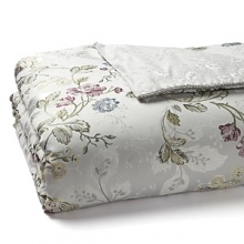 This romantic Waterford comforter boasts a multicolor floral pattern in cool shades of plum, green, slate blue and soft yellow on a silver ground. Resplendent details such as a silver twist cord and luminous silver sprig pattern reverse bring heirloom elegance to your bedroom. This romantic Waterford comforter boasts a multicolor floral pattern in cool shades of plum, green, slate blue and soft yellow on a silver ground. Resplendent details such as a silver twist cord and luminous silver sprig pattern reverse bring heirloom elegance to your bedroom.