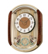 Old fashioned charm and chimes, by Seiko. Melodies in Motion musical wall clock features brown burled finish. On the hour, clock plays one of twelve melodies selected from two sets. First set composed of six traditional melodies; second set composed of Christmas melodies. Dial opens in six segments to reveal six rotating fairies and rotating pendulum made with 28 crystallized Swarovski elements. Includes volume control, demonstration button and light sensor. Measures approximately 20-7/8 inches by 15-1/4 inches by 4-1/2 inches.