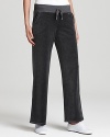 These MICHAEL Michael Kors velour pants update a weekend classic with a trend-right wide leg silhouette and wide drawstring waistband for day-long comfort.