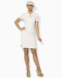 Tailored in soft-touch cotton mesh for a classic, relaxed fit, a chic polo dress is accented with tonal embroidery that celebrates Team USA's participation in the 2012 Olympics.Ribbed polo collar.