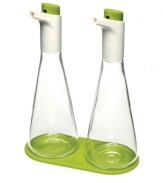 Best-dressed! Your salads and dishes get high marks when coupled with this oil and vinegar set, which features precision flow control so your food never gets doused and always gets just the right amount of dressing. The curved design of each flask fits comfortably in your hand and adds a sleek accent, sitting pretty on the included silicone coaster. 1-year warranty.