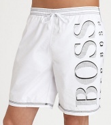 Hit the beach in authentic style in a solid pair with contrast stitching and large BOSS logo.Elastic drawstring waistbandSide slash pocketsInseam, about 7Polyester liningPolyamideMachine washImported