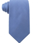 Fine dots add the right amount of texture to this smooth silk tie from Michael Kors.