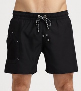 Classic swim trunk style, in a rich solid, finished with side pocket and signature logo detail.Drawstring elastic waistFully linedInseam, about 7PolyesterMachine washImported