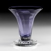 A delightful vase in a delicate amethyst color with a clear base. A lovely piece with or without flowers! Also available in amber.