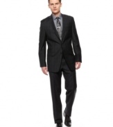 In basic black, this Calvin Klein suit creates the perfect foundation for a look that is strong on details.