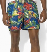 A classic-fitting swim trunk is designed in super-soft, quick-dry microfiber with a tropical parrot print for the ultimate beach-ready style.