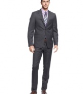 Mix it up. In a sleek charcoal with fine purple lines, this slim-fit suit from Tallia is your most modern look.