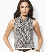 A bold herringbone pattern lends a chic graphic element to the sleeveless Ginnie blouse, tailored in airy, luxuriously smooth silk georgette with an elegant bow tie and keyhole at the neckline.