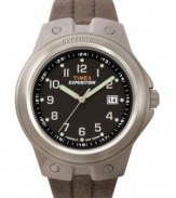 A Timex watch with pleasing design, comfortable fit and practical durability. Tan leather velcro strap and round brushed mixed metal case. Black dial with numerals, logo and date window. Analog movement. Water resistant to 100 meters. One-year limited warranty.