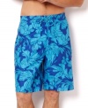 Swim in style with these vibrant print trunks by Nautica.