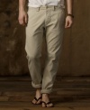 Ruggedly faded and frayed for the quality of a found favorite, this cotton chino pant is updated in a slim, modern fit, giving the classic prepster piece a fresh downtown perspective.