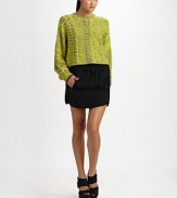 Heathered wool woven in a geometric jacquard, slightly oversized and cropped at the waist.Ribbed crewneckDropped shouldersGathered cuffsPullover styleAbout 20 from shoulder to hem63% wool/29% viscose/7% nylon/1% spandexDry cleanImported