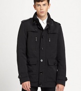 A clean silhouette tailored in performance nylon for a modern edge against the elements, it features a stand collar, shoulder epaulettes and spacious front pockets.Button frontStand collarShoulder epaulettesZippered chest pocketWaist flap pocketsBack ventFully linedAbout 30 from shoulder to hemNylonDry cleanImported