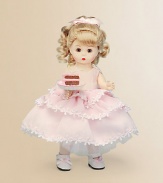 This pretty blonde miss brings birthday wishes to a lucky young lady on her special day.8 cloth dollDressed in a pink, tiered, lace-trimmed frock and white Mary Jane slippersShe offers a luscious-looking slice of birthday cakeRecommended for ages 3 and upImported