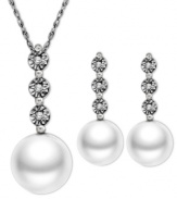 Perfectly elegant. This matching pendant and earrings set highlights cultured freshwater pearls (6-7 mm) and round-cut diamond accents set in sterling silver. Approximate length: 18 inches. Approximate drop (pendant): 3/4 inch. Approximate drop (earrings): 3/4 inch.