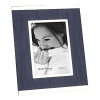 Display your treasured memories in a modern frame banded with silver and balanced with denim fabric.