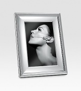 Elegant, finely-polished silverplated design gives proper attention to a favorite 4 X 6 photograph. From the Perles Collection A terrific gift idea Wood base Made in Italy