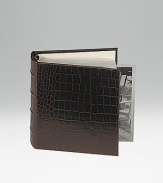 Crafted of crocodile-embossed Italian calfskin, this handsome design is the perfect way to store and display treasured photos. 18 clear pocket leaves hold 36, 4 X 6 photos 5½ X 6¾ Made in USA
