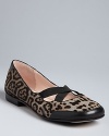 Elastic criss-cross straps make these shoes as secure as they are stylish, in an exotic leopard print. Orthopedic-surgeon-turned-designer Taryn Rose's signature soles make these flats fantastically comfortable as well: Run wild.