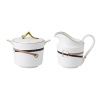 Wedgwood pays tribute to the traditional English equestrian lifestyle with this fine sugar bowl and creamer inspired by the work of 18th-century horse painter George Stubbs. Burnished gold silhouettes, classic stirrup stripes and rich shades of tan and brown evoke the stylish essence of horse riding.