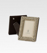 A keepsake accent for life's favorite moments and people, upholstered in smooth leather with 14k gold or platinum-plated braiding. Accommodates a 2 X 3 photograph Hand wipe Imported
