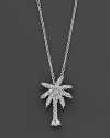 From the Tiny Treasures collection, a diamond palm tree necklace; with signature ruby accent. Designed by Roberto Coin.