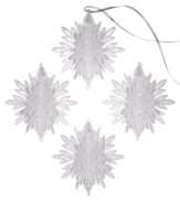 Shimmer and shine. Add a look of winter wonderment to your tree with this set of four snowflake ornaments embellished with silver sparkles for a luminous quality.
