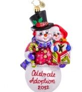 Cheer for a worthy cause. Handcrafted by Christopher Radko, the Celebrate Adoption 2012 ornament benefits the Dave Thomas Foundation, an organization that finds families for waiting children and raises awareness about adoption.
