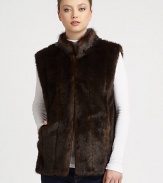 Get set to turn heads in this gorgeous faux fur design with a stand collar and convenient front hook closure.Stand collarSleevelessFront hook closureVelvet-lined side pocketsAbout 26 from shoulder to hemFully linedAcrylicDry cleanMade in USA of imported fabric