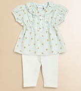 This floral cotton tunic & leggings set embodies sweet, feminine style with delicate lace, pretty ruffles and embroidered Swiss dots.Ruffled crewneckShort puffed sleevesButton front placket adorned with ruffles and laceTunic has elastic waistGently flared hemLeggings have elastic waistCottonMachine washImported Please note: Number of buttons/snaps may vary depending on size ordered. 