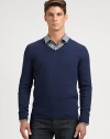 Slim-fitting, extra-fine virgin wool sweater with contrast color detail at inside collar trim.V-neckRibbed knit cuffs and hemWoolDry cleanImported