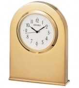 Crafted with beautifully understated modern style, this desktop clock adds elegance to any setting. Goldtone solid brass case. Round white dial with logo and numeral indices. Battery included. Measures approximately 3-3/4 x 2-3/4 x 3/4.