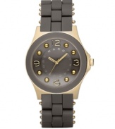 Rich as chocolate and perfectly on trend, by Marc Marc Jacobs. Vine silicone-wrapped stainless steel bracelet with gold ion-plated accents. Round gold ion-plated case with concave ring. Vine-colored dial features goldtone hands, logo, numerals at twelve, three, six and nine o'clock and gold ion-plated dot markers. Quartz movement. Water resistant to 30 meters. Two-year limited warranty.