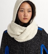 This nubby cotton knit wraps around the head and shoulders as a cozy topper to any outfit.Cotton Dry clean Imported