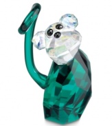 Cheeky monkey. More than a lovable jokester, Rolly shines with an emerald-green body and sparkling clear head in faceted Swarovski crystal.